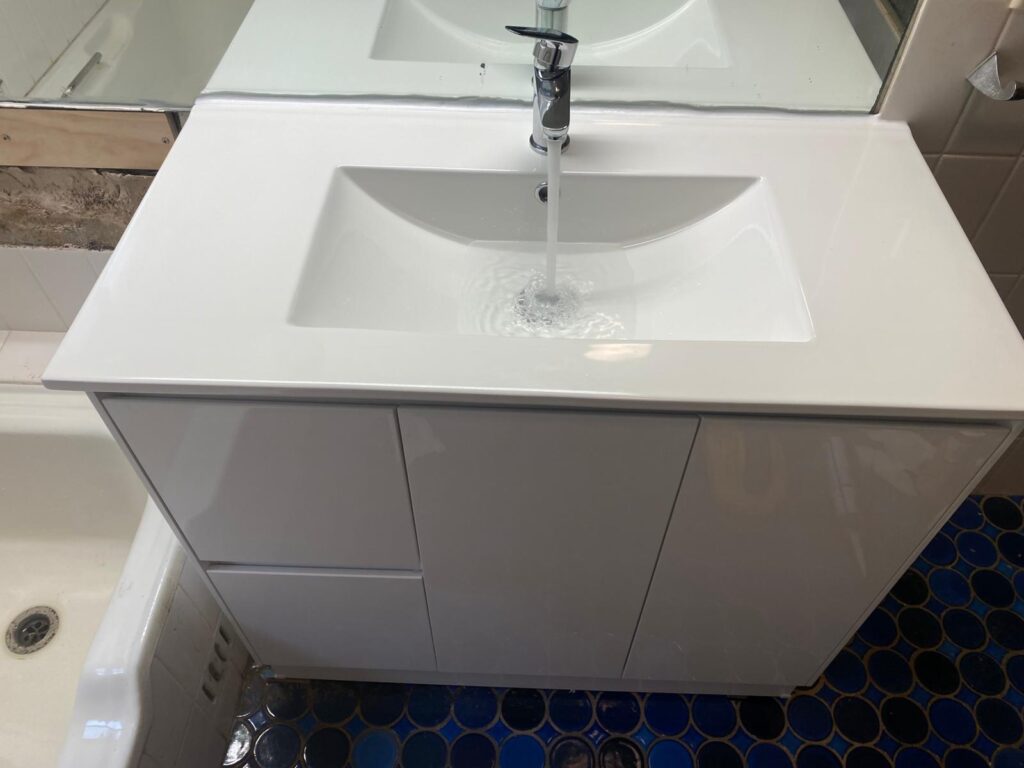 Acacia Plumbing clearing bottle trap under bathroom sink - Hornsby licensed plumber